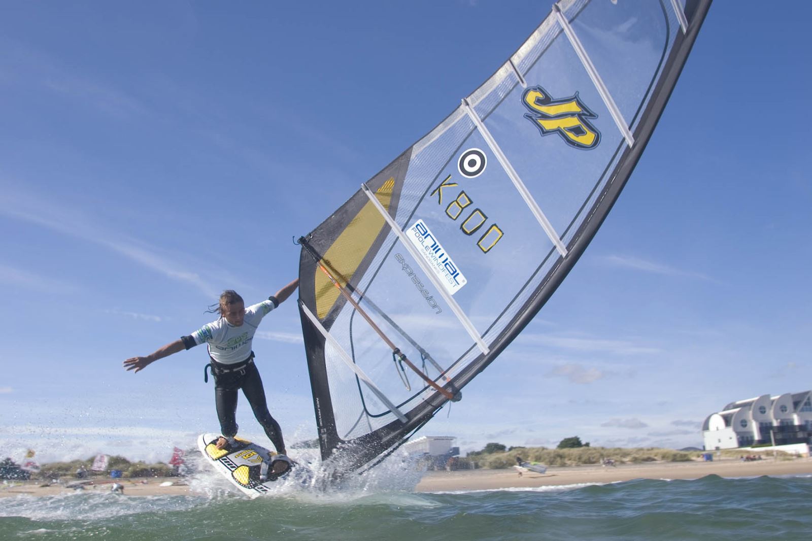 Man windsurfing at a beach in Poole 